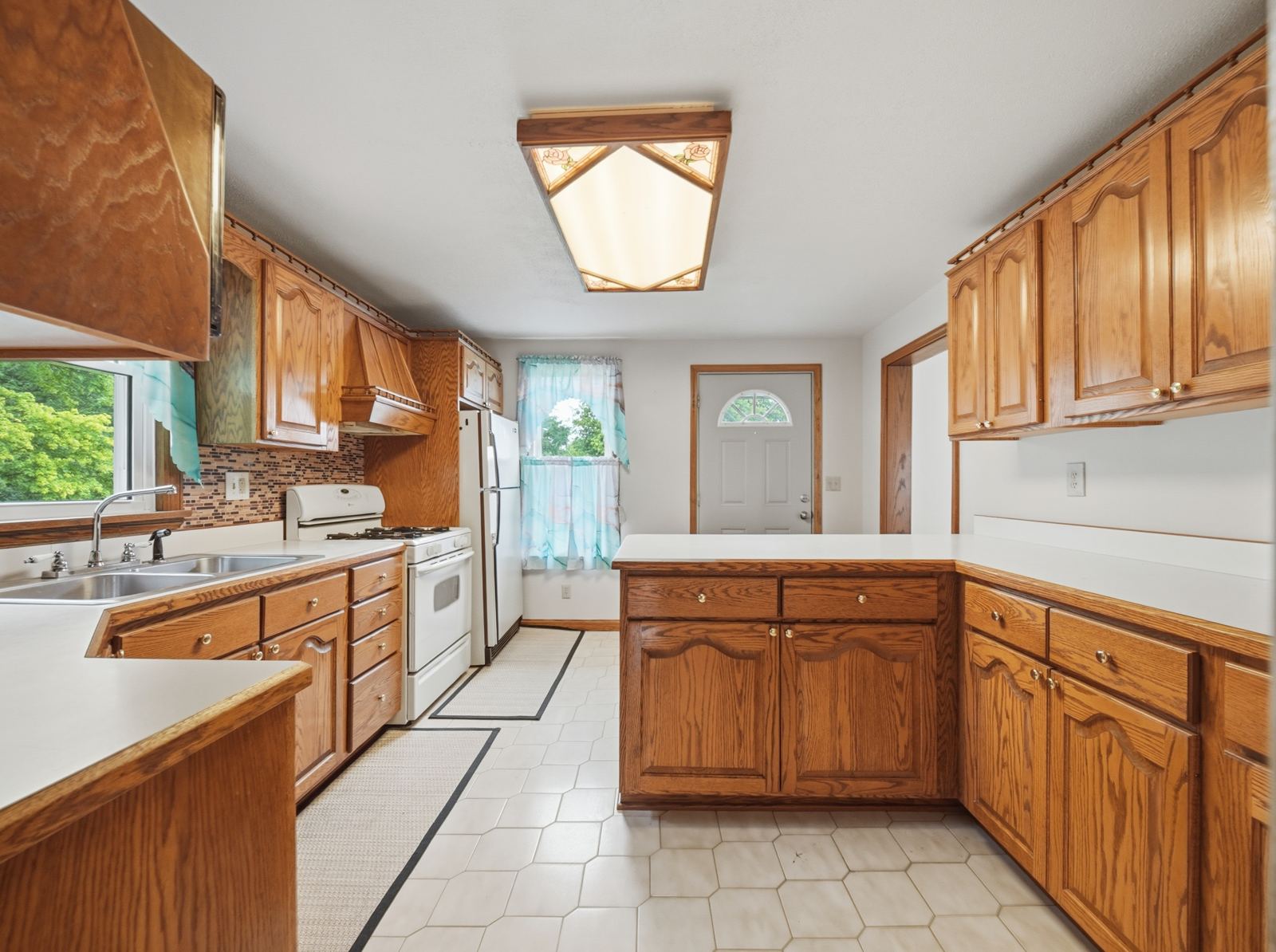Kitchen with wood cabinets